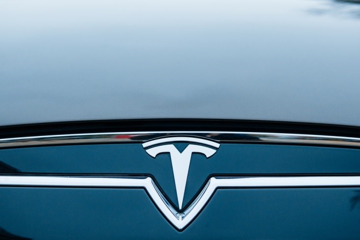 Tesla Motors_Close-up shot of Tesla logo-FinanceBrokerage 