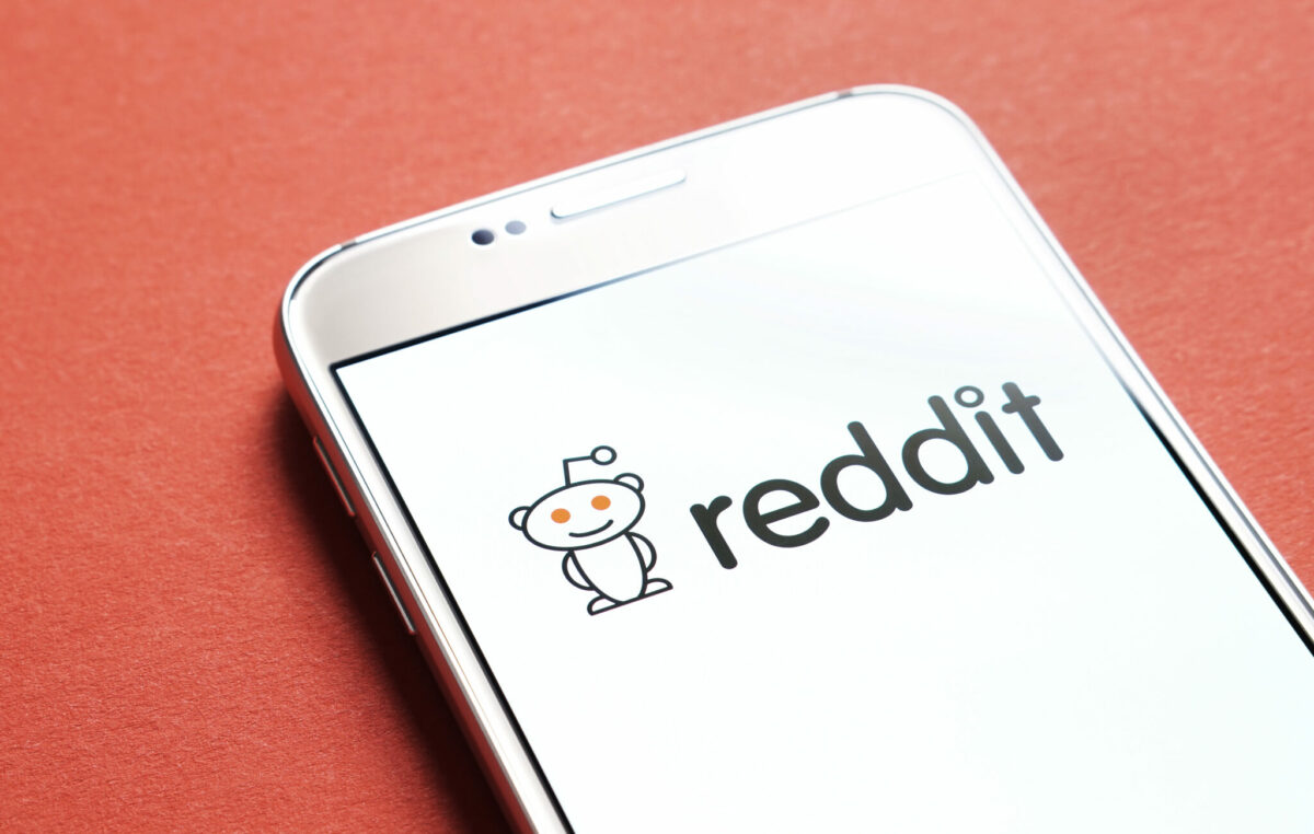 reddit logo on a phone screen