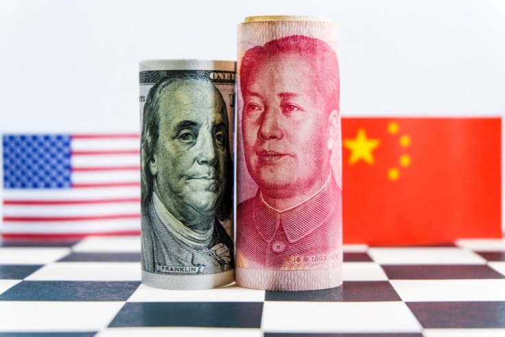 Finance Brokerage – dollar and renminbi bills facing