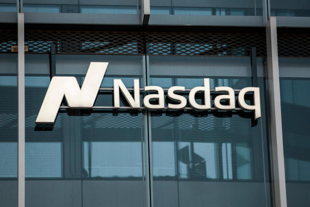 Finance Brokerage – NASDAQ: NASDAQ logo in their building.