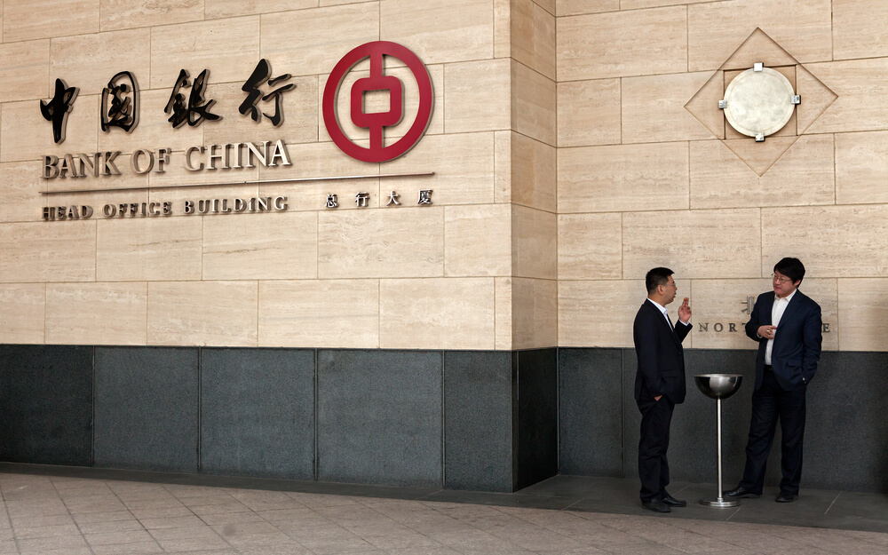 Bank of China headquarters with two men in side.