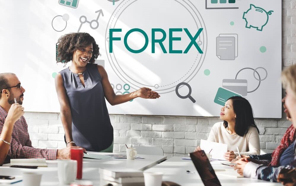 A group of people discussing forex trading – Finance Brokerage