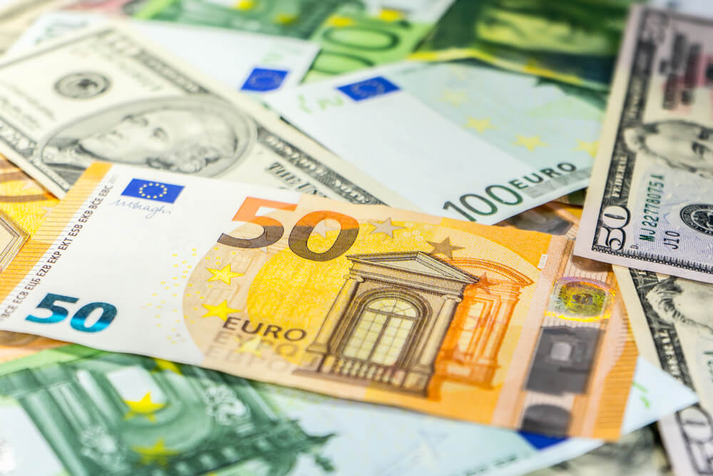 Eur Usd: Background of 50, 100 dollar and 50, 100 euro banknotes.