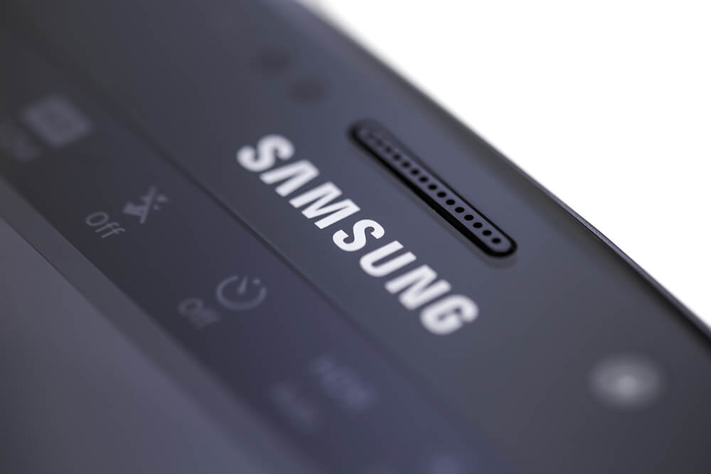 Samsung: Photo detail of Samsung Galaxy S7 against white.